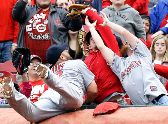 Matt Adams gives the bird to a fan after chasing a foul ball